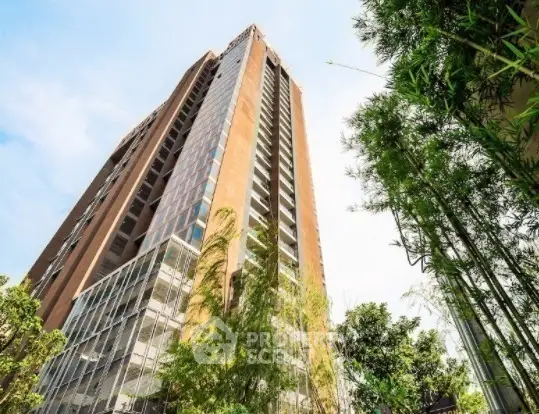 Stunning high-rise building with modern architecture and lush greenery.