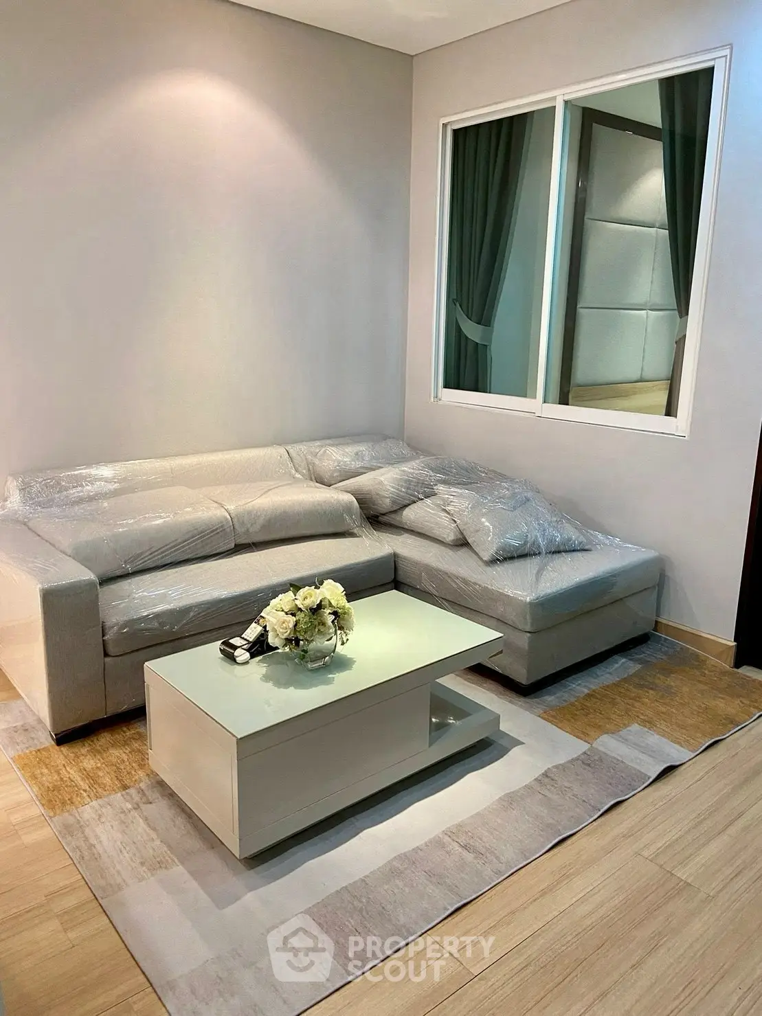 Modern living room with stylish sofa and coffee table, perfect for cozy gatherings.