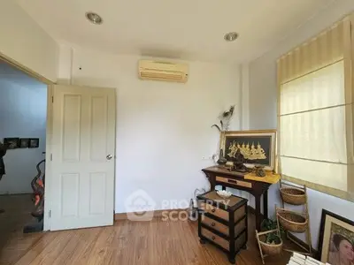 Charming study room with wooden flooring and elegant decor