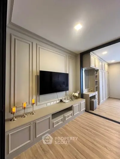 Elegant modern living room with wall-mounted TV and stylish decor