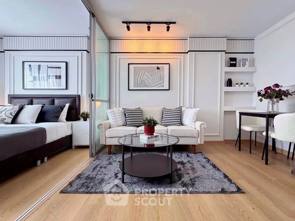 Modern living room with stylish decor and cozy seating area in a contemporary apartment.