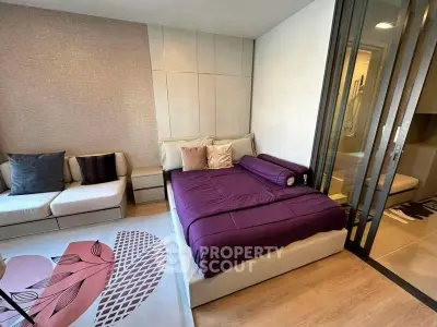 Modern bedroom with stylish decor and cozy seating area