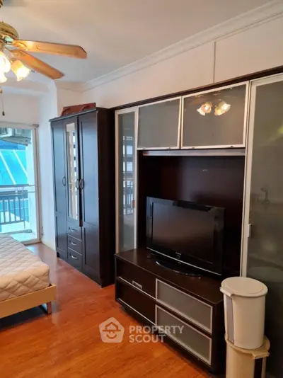 Cozy bedroom with modern furniture and balcony view