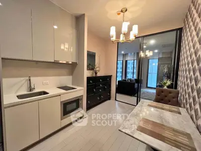 Modern kitchen with open layout and elegant dining area in stylish apartment