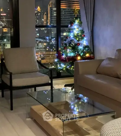 Stylish living room with city view and festive Christmas tree, featuring modern furniture and elegant decor.