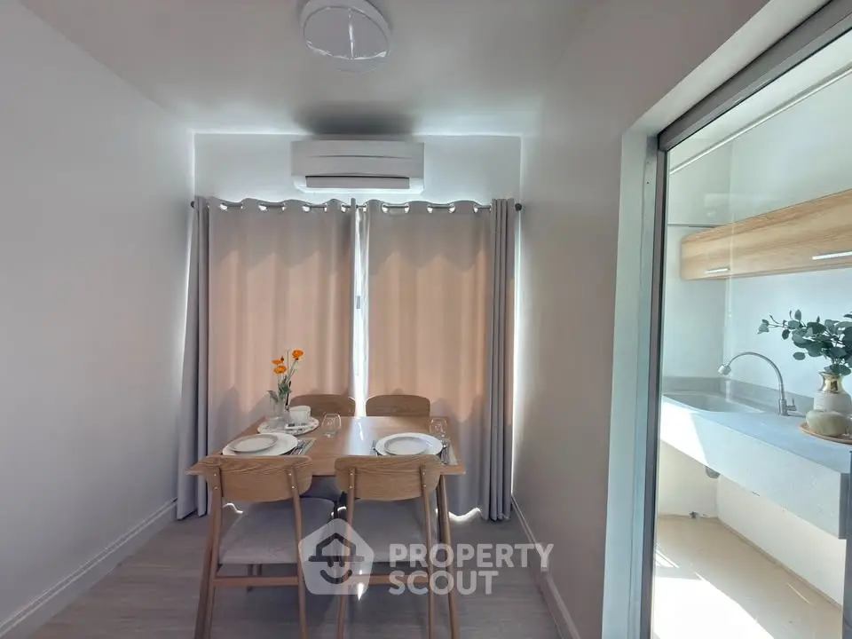 Charming dining area with natural light and modern decor