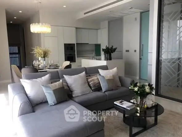 Modern living room with elegant decor and open kitchen layout