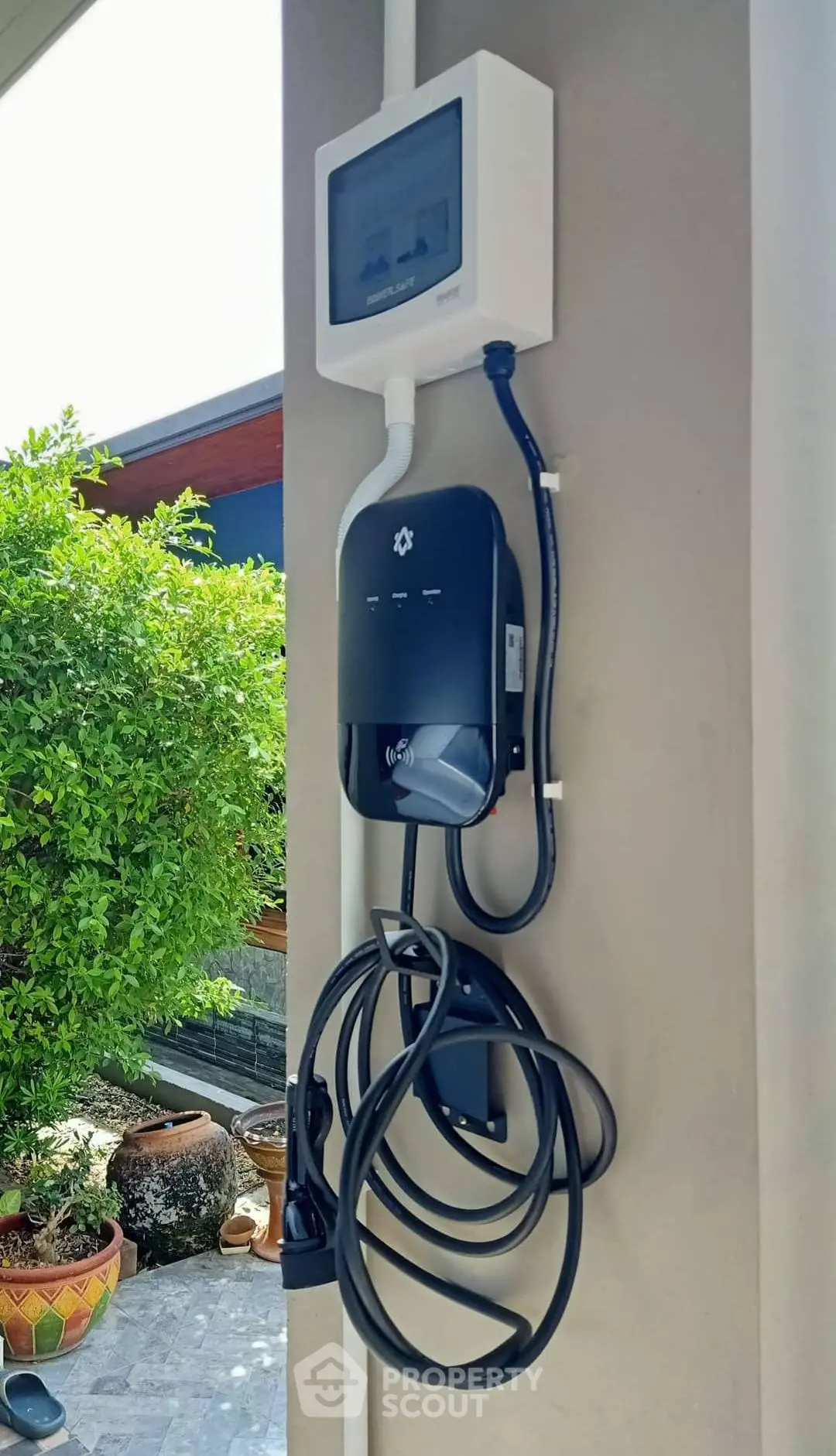 Modern electric vehicle charging station in residential outdoor setting