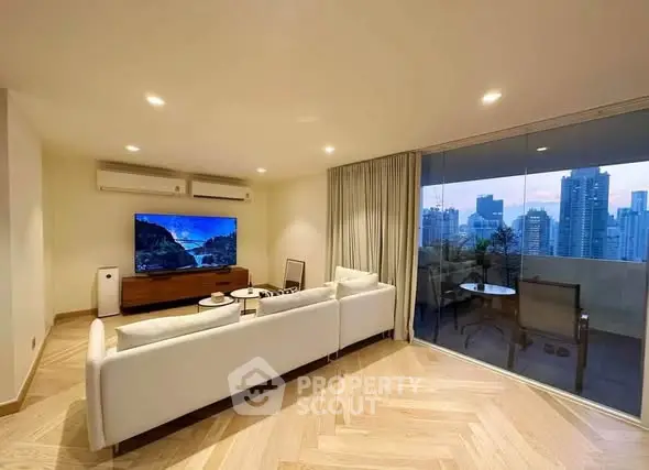 Luxurious living room with city view and spacious balcony in modern apartment
