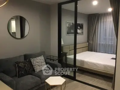 Modern studio apartment with cozy living area and stylish bedroom