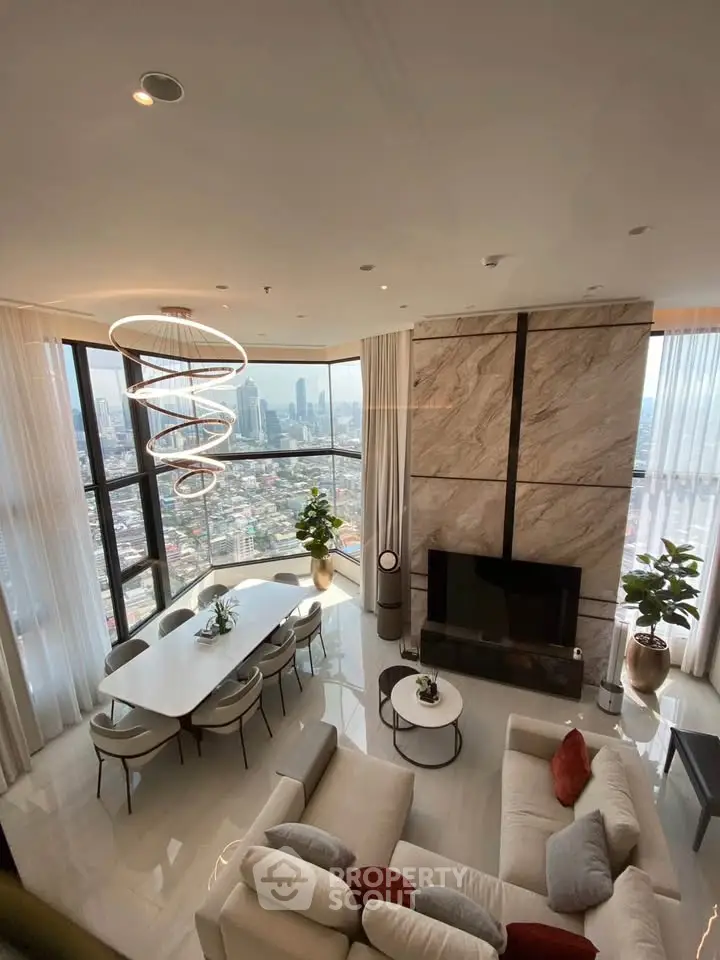 Luxurious high-rise living room with stunning city views, modern decor, and elegant lighting.