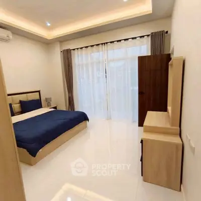 Spacious modern bedroom with elegant design and natural light