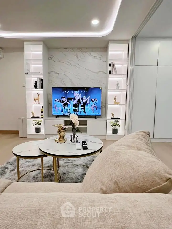 Modern living room with stylish built-in shelves and cozy seating area