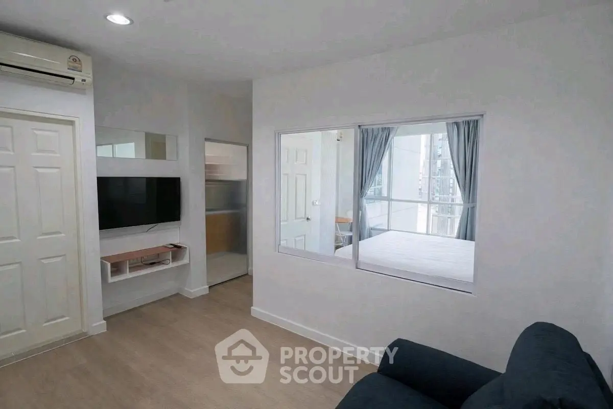 Modern apartment interior with cozy living room and bedroom view