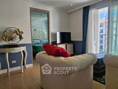 Charming living room with elegant decor and balcony view in modern apartment.