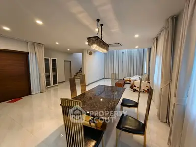 Spacious modern living room with elegant dining area and stylish decor