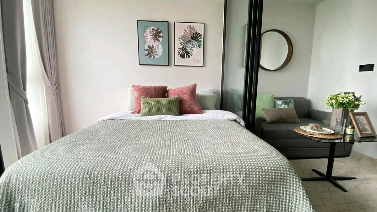 Cozy bedroom with stylish decor and natural light