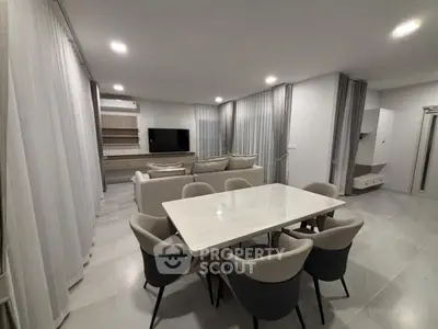 Modern living room with elegant dining area and stylish furniture