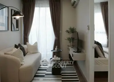 Chic modern living room with cozy sofa, stylish decor, and natural light, perfect for urban living.
