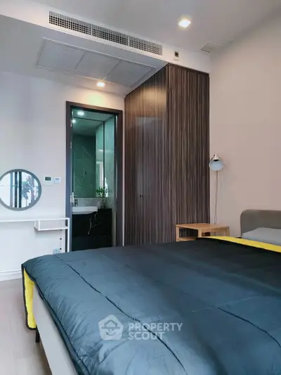 Modern bedroom with sleek design and ensuite bathroom