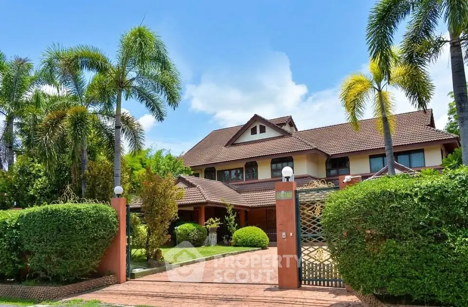 Stunning tropical villa with lush garden and elegant architecture, perfect for luxurious living.
