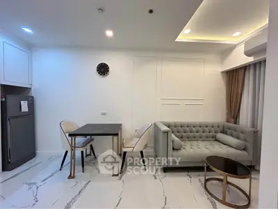 Modern living room with elegant sofa and dining area in a stylish apartment