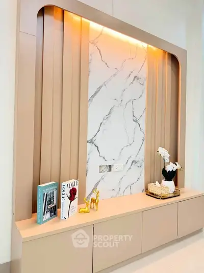 Elegant living room with modern marble accent wall and stylish decor