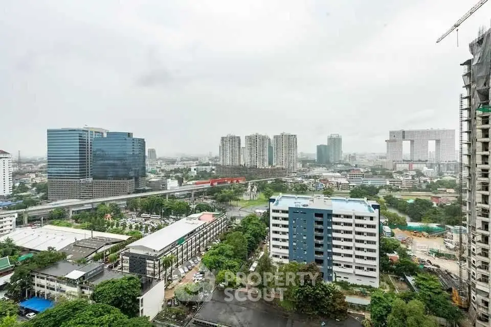 Stunning cityscape view from high-rise building showcasing urban skyline and modern architecture.