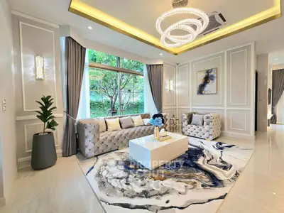 Luxurious living room with elegant decor and large window view