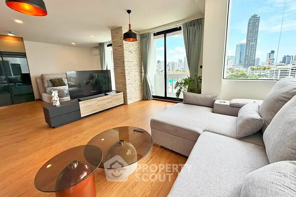 Spacious modern living room with city view and stylish furniture