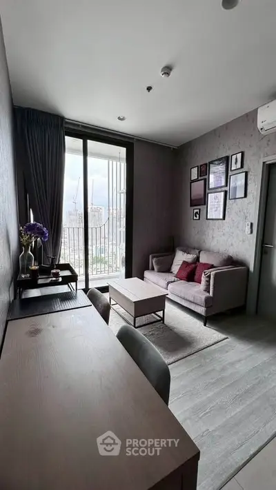 Modern living room with stylish decor and city view from large window