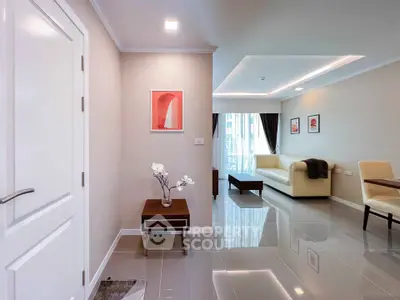 Modern living room with sleek design and elegant furniture in a bright apartment.