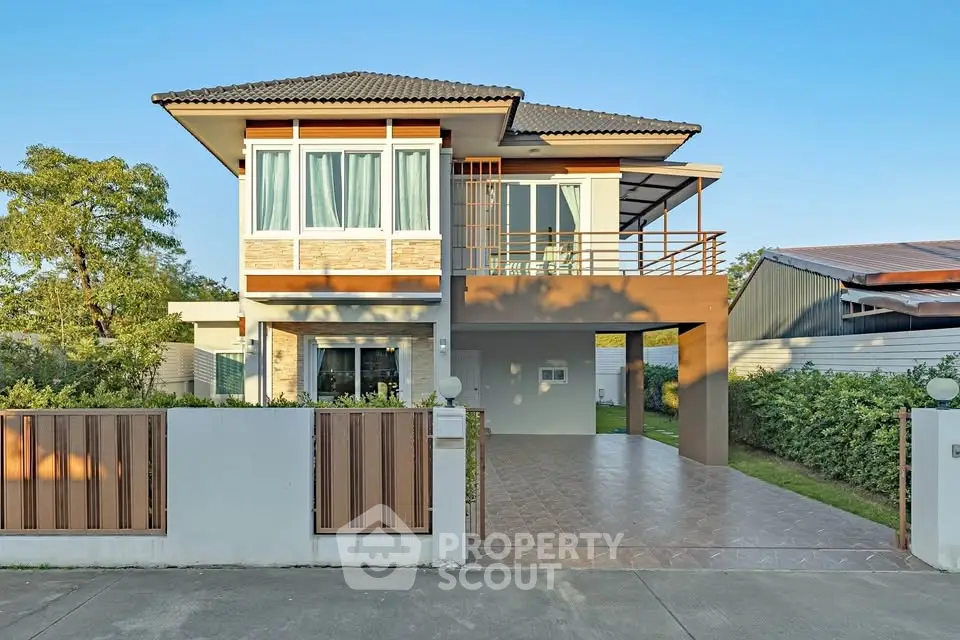 Modern two-story house with spacious driveway and large windows, perfect for family living.