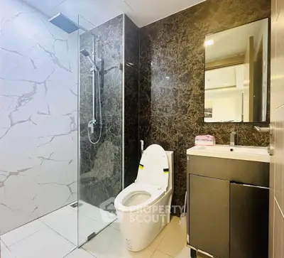 Modern bathroom with sleek shower and elegant marble walls