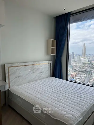 Modern bedroom with stunning city view and large window