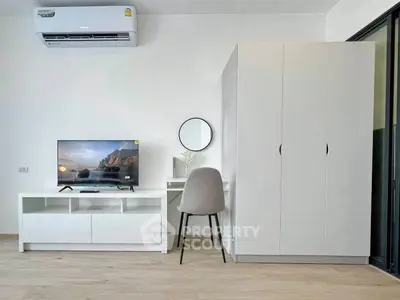 Modern minimalist living space with sleek furniture and air conditioning