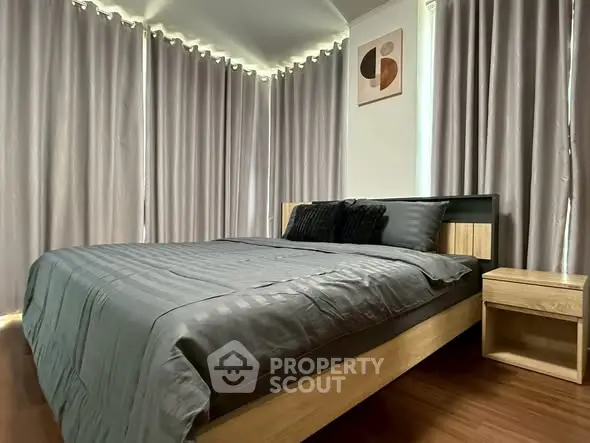 Modern bedroom with stylish decor and natural light