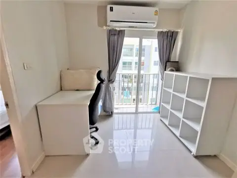 Bright study room with balcony access and modern furnishings