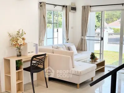 Bright and airy living room with modern decor and garden view, perfect for relaxation.