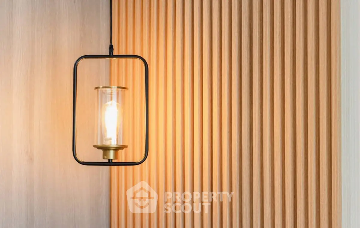 Modern interior with stylish pendant light and wooden paneling