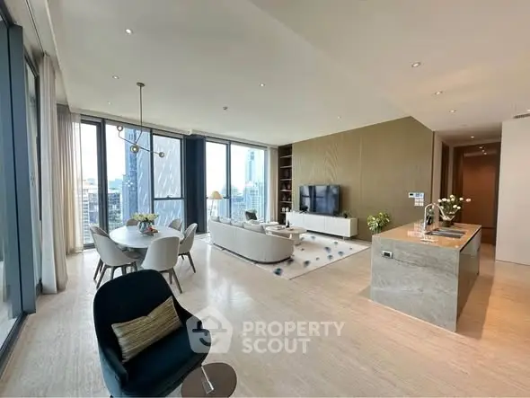 Luxurious open-plan living room with stunning city views and modern decor.