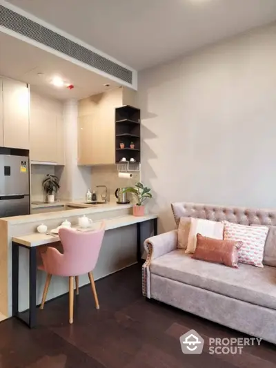 Chic studio apartment with a seamless open layout, featuring a modern kitchen with high-end appliances, and a cozy living area with stylish furnishings.