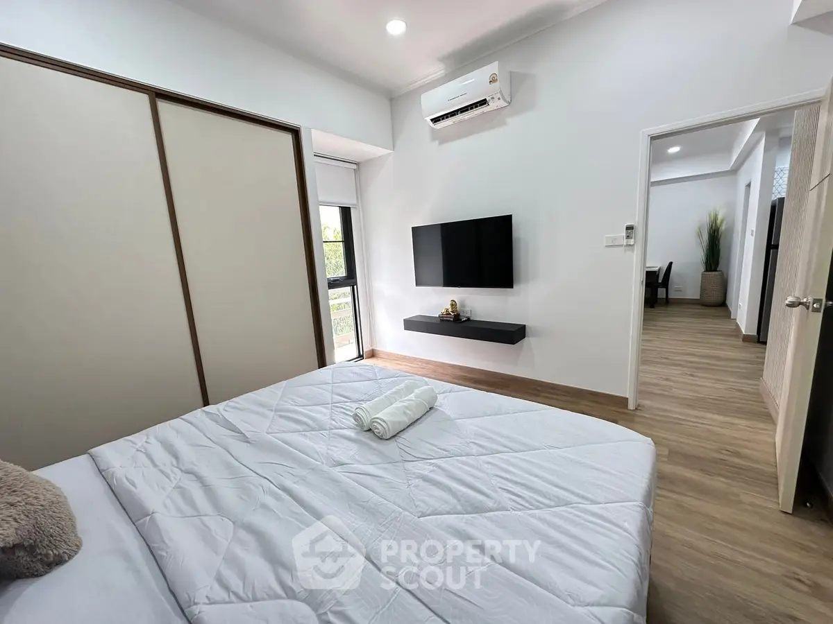Modern bedroom with minimalist decor and natural light