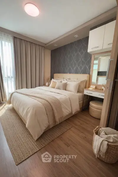 Elegant bedroom with modern decor, cozy bed, and natural light creating a serene atmosphere.
