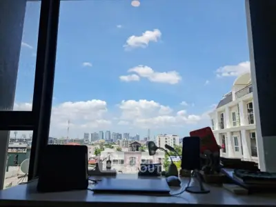 Stunning cityscape view from a modern home office window, perfect for inspiration and productivity.