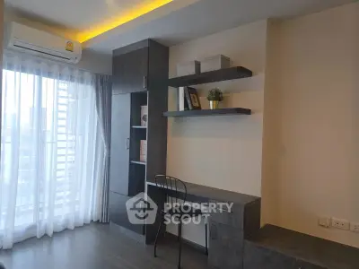 Modern study room with built-in desk and shelves, featuring large window with city view.