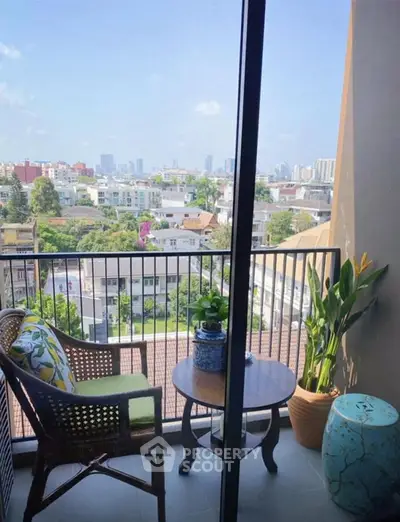Charming balcony with city view, perfect for relaxation and enjoying the skyline.