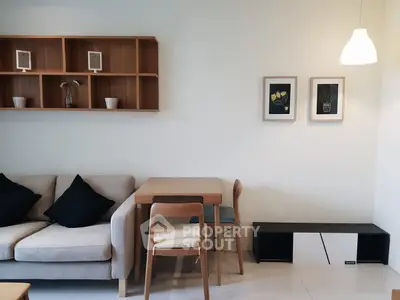 Modern living room with stylish furniture and elegant wall decor