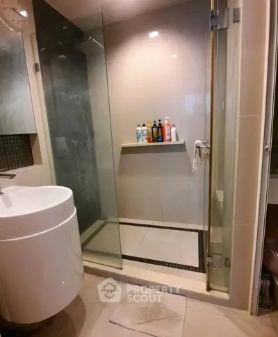 Modern bathroom with glass shower and sleek sink design