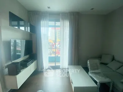 Modern living room with balcony view and sleek furniture
